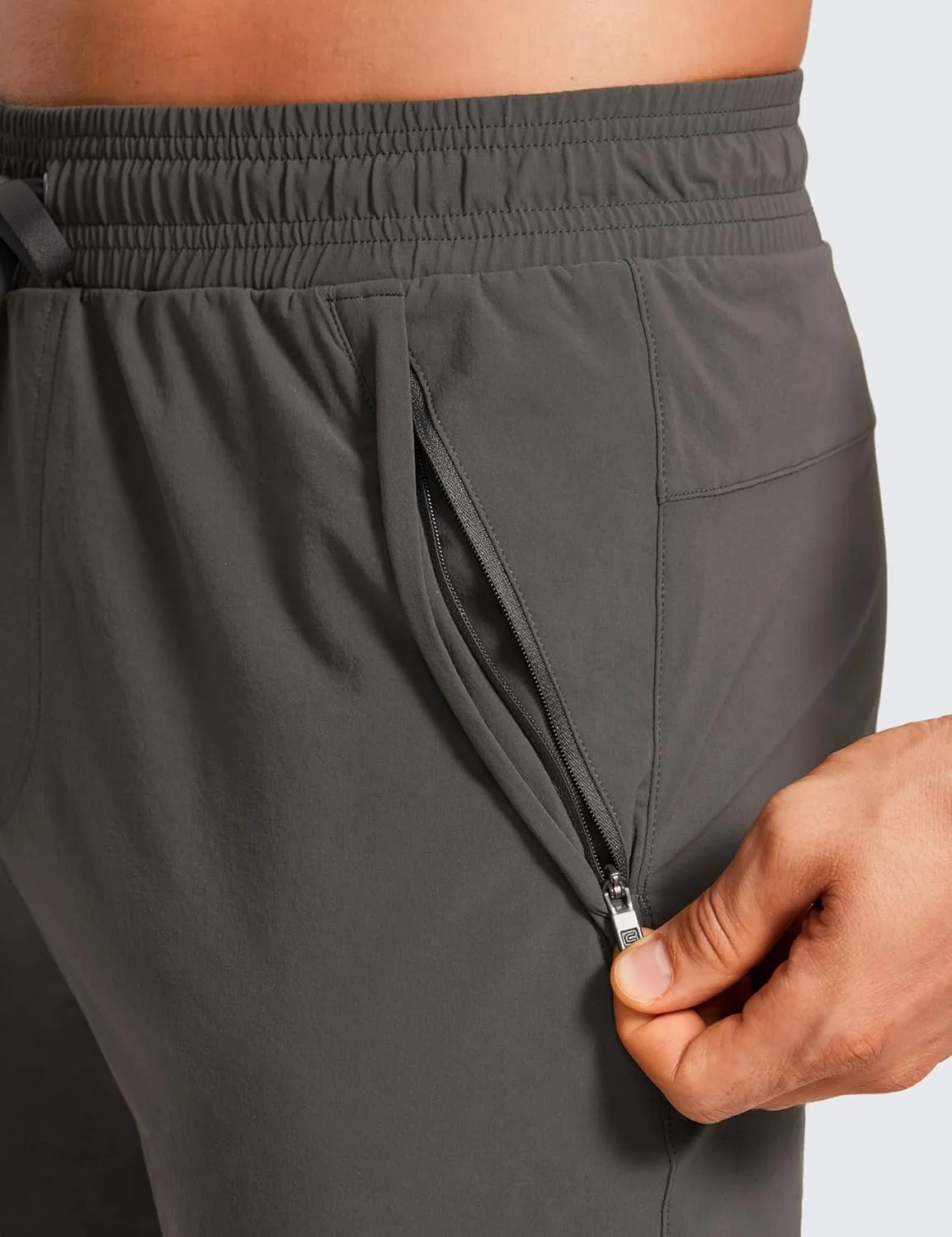 CRZ YOGA Athletic Joggers for Men 29"/31" Lightweight Water Resistant Outdoor Workout Pants with Zip Pockets